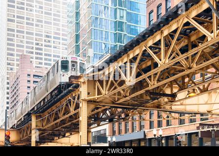 Train on elevated rail tracks in downtown Chicago on a spring day Stock Photo