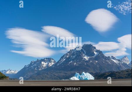 Iceberg and cloud formation, Lago Grey, Torres del Paine National Park, Parque Nacional Torres del Paine, Cordillera del Paine, Towers of the Blue Stock Photo