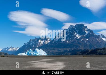 Iceberg and cloud formation, Lago Grey, Torres del Paine National Park, Parque Nacional Torres del Paine, Cordillera del Paine, Towers of the Blue Stock Photo