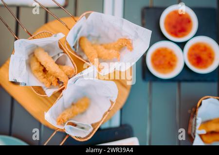 Delicious fried shrimps elegantly served with sauces on the restaurant table, Portugal Stock Photo