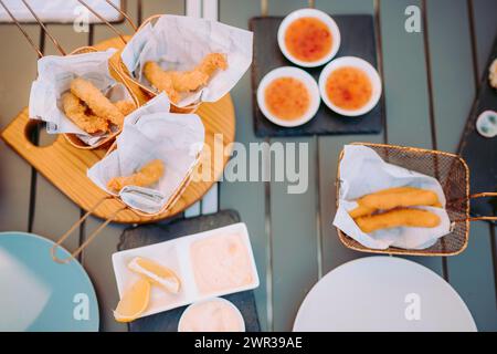 Delicious fried shrimps elegantly served with sauces on the restaurant table, Portugal Stock Photo