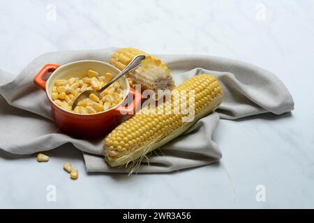 Fresh maize kernels in pots and cobs, corn (Zea mays) Stock Photo