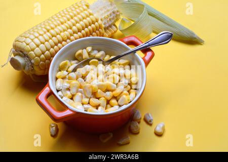 Fresh maize kernels in pots and cobs, corn (Zea mays) Stock Photo