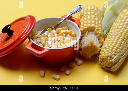 Fresh maize kernels in pots and cobs, corn (Zea mays) Stock Photo