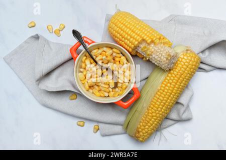 Fresh maize kernels in pots and cobs, corn (Zea mays) Stock Photo