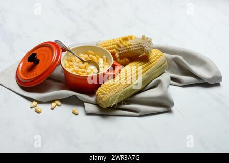 Fresh maize kernels in pots and cobs, corn (Zea mays) Stock Photo