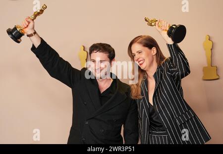 Hollywood, United States. 10th Mar, 2024. Arthur Harari and Justine Triet of 'Anatomy of a Fall,' appear backstage with the Oscar for Best Original Screenplay at the 96th annual Academy Awards in Los Angeles, California, on Sunday, March 10, 2024. Since 1929, the Oscars have recognized excellence in cinematic achievements. Photo by Pat Benic/UPI Credit: UPI/Alamy Live News Stock Photo