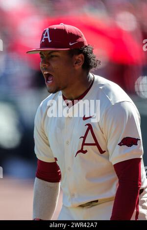 March 10, 2024: Kendall Diggs #5 of Arkansas comes out of the dugout to greet a fellow team mate following a home run. Arkansas defeated McNeese 18-5 in Fayetteville, AR. Richey Miller/CSM(Credit Image: © Richey Miller/Cal Sport Media) Stock Photo