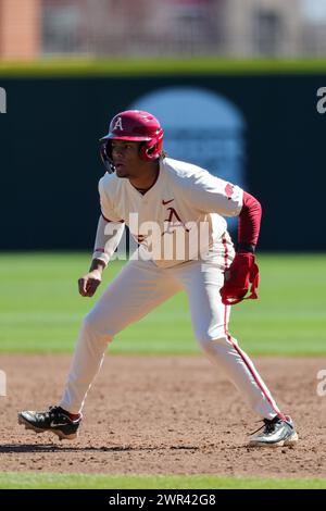 March 10, 2024: Arkansas outfielder Kendall Diggs #5 works to increase his lead off first base. Arkansas defeated McNeese 18-5 in Fayetteville, AR. Richey Miller/CSM Stock Photo