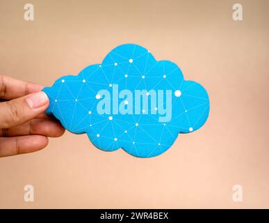 Cloud computing connection, network security technology concept. Blue cloud, holding by businessman hand isolated on white background, minimal style. Stock Photo