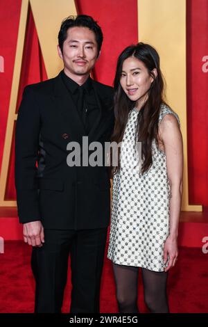 Steven Yeun and Joana Pak walking on the red carpet at the 34th Film ...