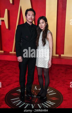 Steven Yeun and Joana Pak walking on the red carpet at the 34th Film ...