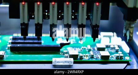 Electrical circuit board design steps Connector type solenoid valve Compressed air direction control system,Components in an automated production line Stock Photo