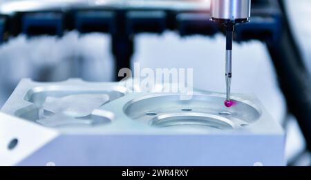 Close up automatic coordinate measurement machine (CMM) for inspection high precision engine block during working Stock Photo