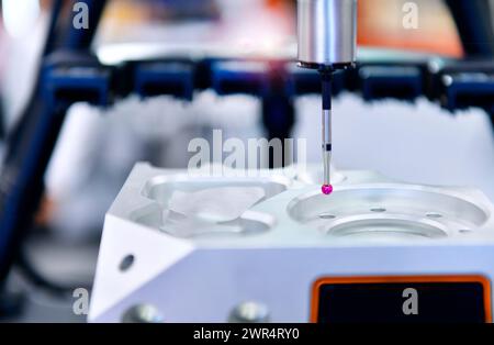 Close up automatic coordinate measurement machine (CMM) for inspection high precision engine block during working Stock Photo