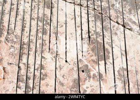 A closeup of a cracked beige wall Stock Photo