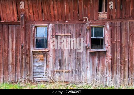 Old decayed red barn in the country Stock Photo