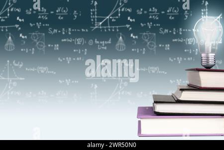 A stack of books in the shape of a staircase with a burning light bulb on top, against a gradient background of mathematical formulae and graphs. Conc Stock Photo