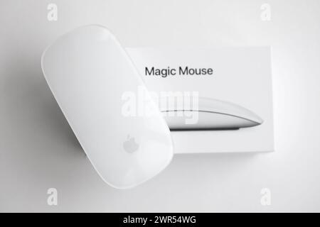 KYIV, UKRAINE - NOVEMBER 27, 2023 Apple Magic Mouse 3rd generation lies on white background close up Stock Photo