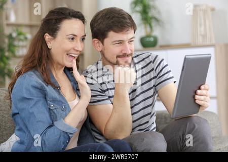 happy husband and his wife with tablet pc Stock Photo