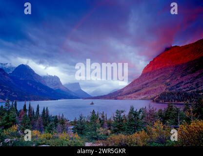 USA: Montana: Glacier National Park: A stormy sunrise over Saint Mary Lake, Wild Goose Island, and Goat Mountain Stock Photo