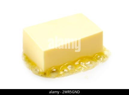 A piece of melting butter isolated on white background Stock Photo