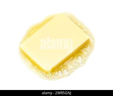 Butter melting isolated on white background Stock Photo