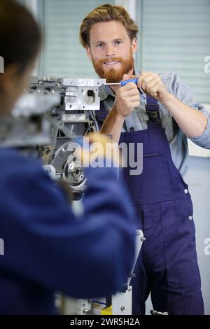 a man is screwing frames Stock Photo