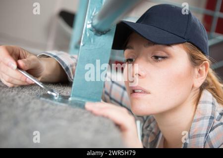 side view of an experienced manual female worker Stock Photo
