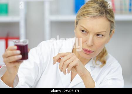 senior female scientist works in modern laboratory Stock Photo