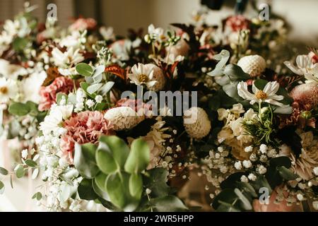 Flower background of various white and pink flowers with greenery Stock Photo