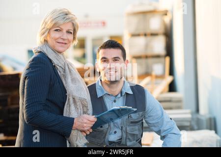 senior manager with younger workr in modern plant Stock Photo