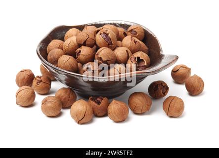 shagbark hickory nuts on white background Stock Photo