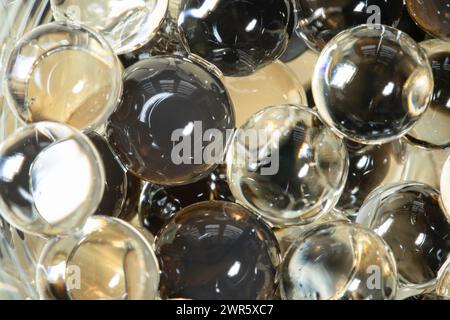 Scented gel beads (hydrogel) in close-up, light reflections. Background. Stock Photo