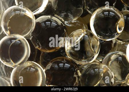 Scented gel beads (hydrogel) in close-up, light reflections. Background. Stock Photo
