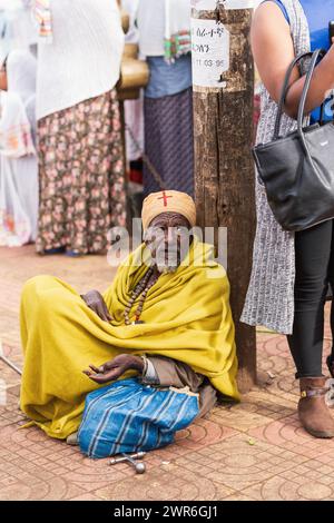 BAHIR DAR, ETHIOPIA, APRIL 21th. 2019, Old orthodox Christian monk resting on the street of Bahir Dar during Easter holiday. April 21th. 2019, Bahir D Stock Photo