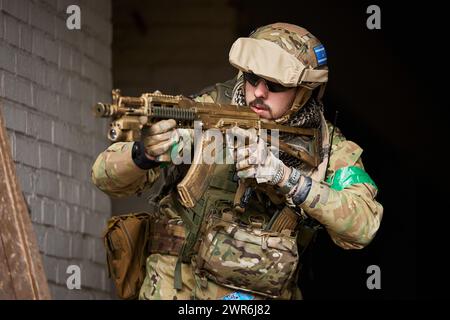 Soldier aiming airsoft gun during tactical game Stock Photo - Alamy