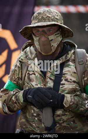 Portrait of Ukrainian soldier wearing protective tactical mask on a training grounds. Kyiv - 9 March,2024 Stock Photo