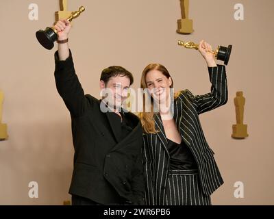 March 10, 2024, Hollywood, California, U.S.: Arthur Harari and Justine Triet in the Press Room during the 96th Academy Awards, presented by the Academy of Motion Picture Arts and Sciences (AMPAS), at the Dolby Theatre in Hollywood. (Credit Image: © Billy Bennight/ZUMA Press Wire) EDITORIAL USAGE ONLY! Not for Commercial USAGE! Stock Photo