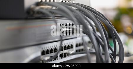 Optical mains cables connected to main server closeup Stock Photo