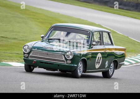 David Dickenson, Andrew Jordan 1966 Ford-Lotus Cortina MkI during the Jim Clark Trophy race at Goodwood 80th Members Meeting, Sussex, UK Stock Photo