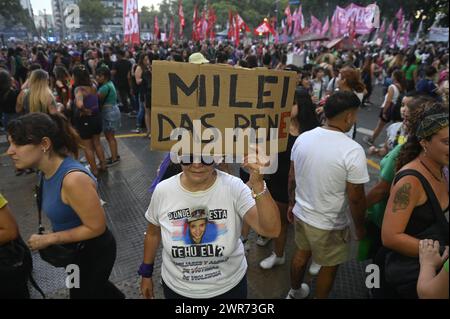 08 March 2024, Argentina, Buenos Aires: A woman holds a placard against the ultra-liberal President Milei during the demonstration on International Women's Day. The government of the new head of state has banned the use of gender-sensitive language in all federal agencies. The former Ministry of Women, Gender and Diversity was dissolved as such and subordinated to the new Ministry of Human Capital. Photo: Igor Wagner/dpa Stock Photo