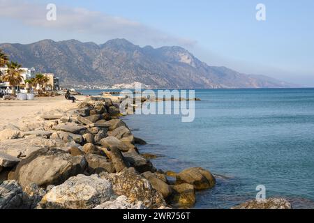 Kos, Greece - May 12, 2023: Rocky coast on the beach in Kardamena resort. Kos island, Greece Stock Photo
