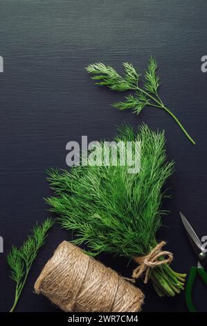 Herbs and spices, condiments, seasoning. Aromatic spice for cooking. Dill. Natural fresh herbs and spice on rustic wood background in the kitchen for Stock Photo