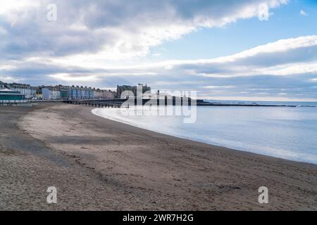 View across the beach towards the Ceredigion coastal town of Aberystwyth West Wales UK. January 2024 Stock Photo