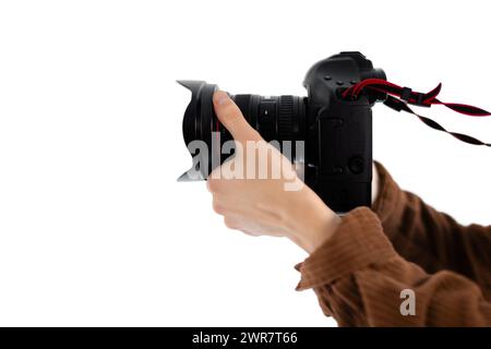 Close-up of male hands holding professional camera Stock Photo