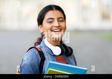Portrait of arab young woman student posing outdoors Stock Photo