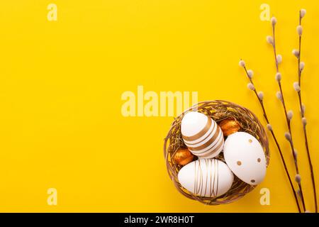 Easter eggs on yellow background. Greetings card, Happy Easters. Flat lay ,top view Stock Photo