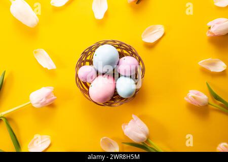Easter eggs on yellow background. Greetings card, Happy Easters. Flat lay ,top view Stock Photo
