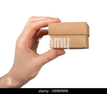 Hand holding small little mini gift box isolated on white background. Stock Photo